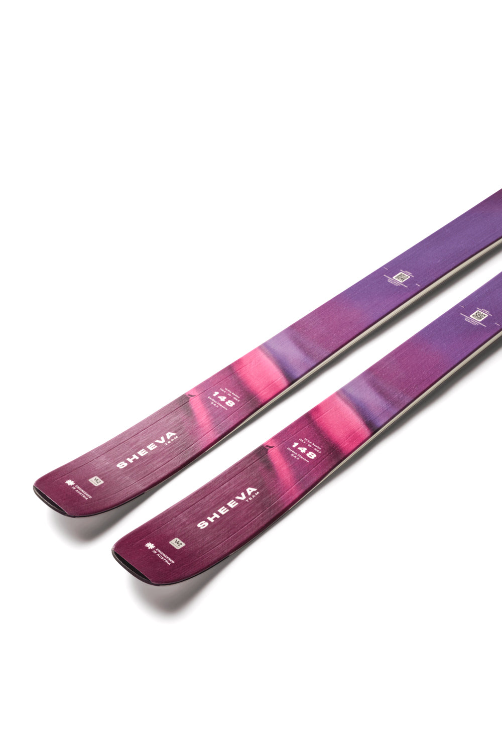 Two purple skis with a brand logo on a white background