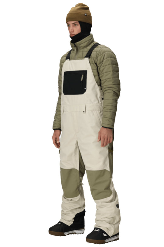 person wearing snow bib overall pants