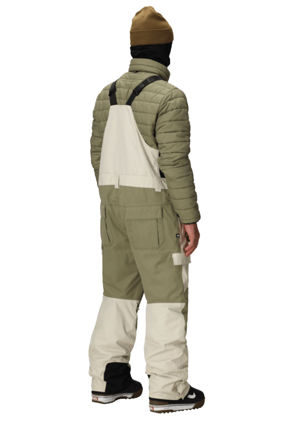 person wearing snow bib overall pants