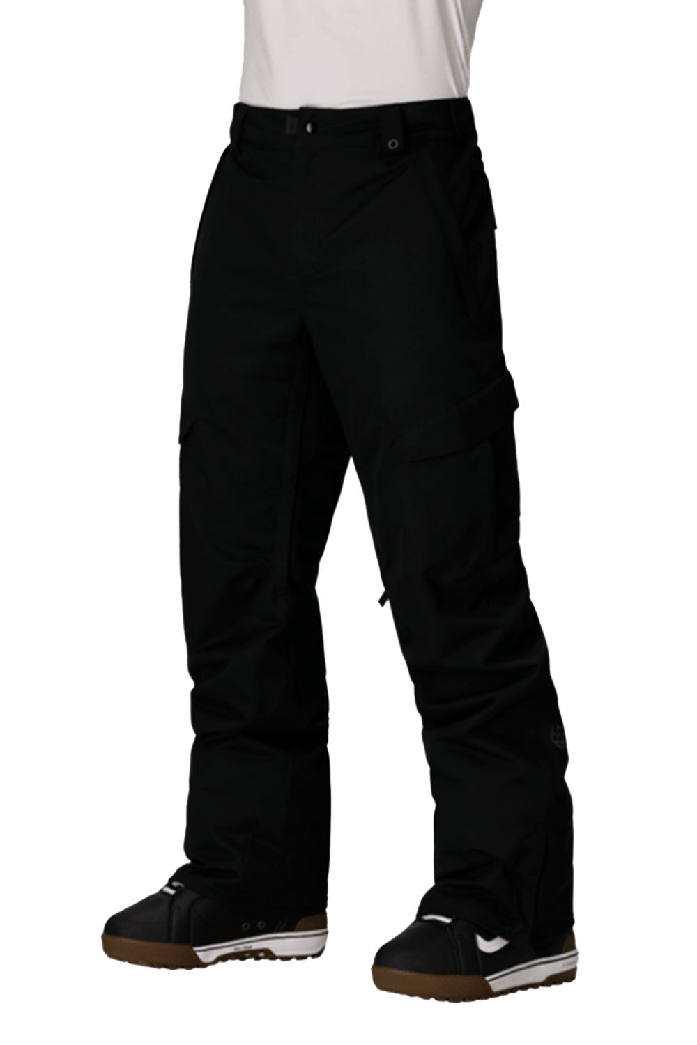 Black snow pants worn by a person on a white background