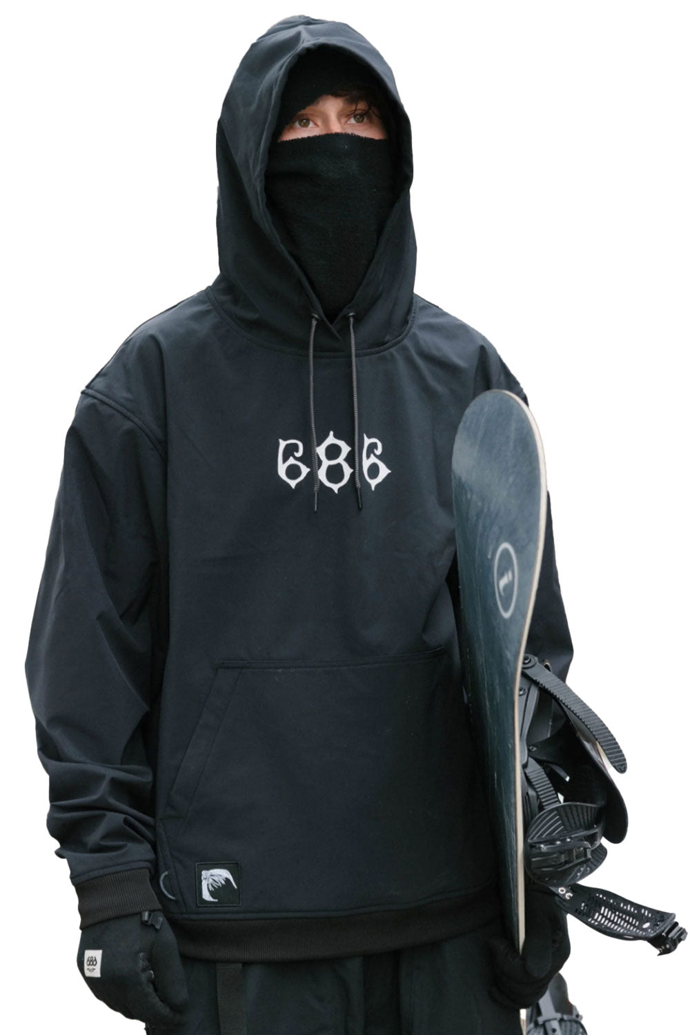 Person wearing a black hoodie with a logo, holding a snowboard on a white background