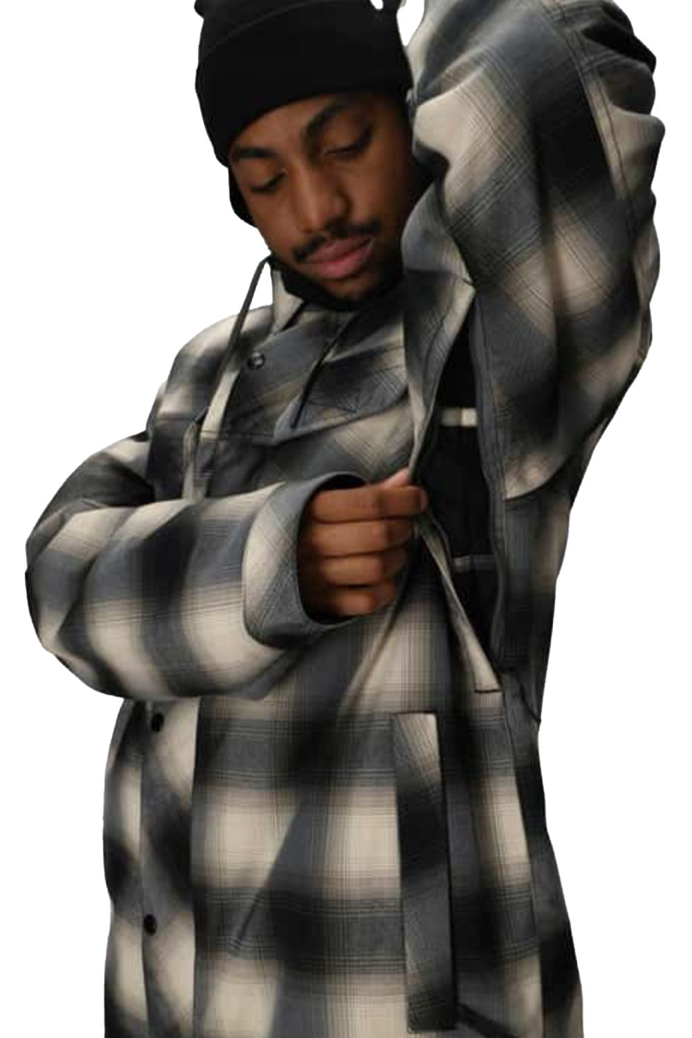 Person wearing a black and white checkered coat on a white background