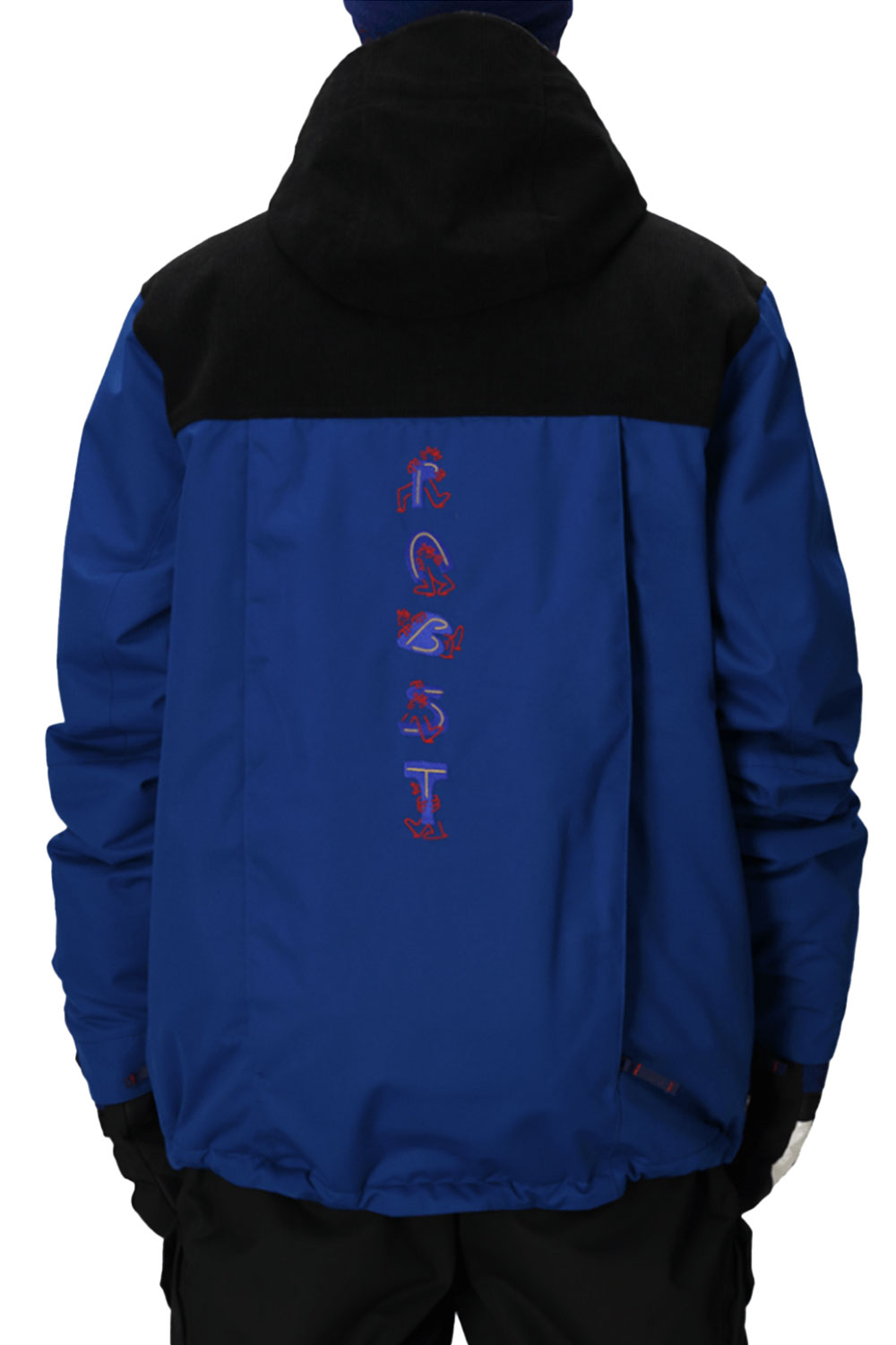 Blue and black jacket with red and white text on the back, worn by a person.