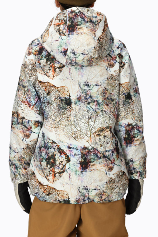 Multicolored patterned jacket worn by a person on a white background