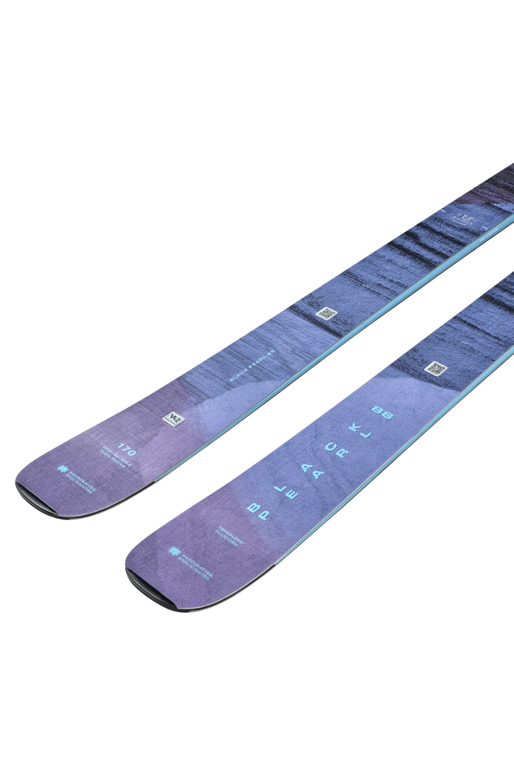 Pair of purple skis on a white background