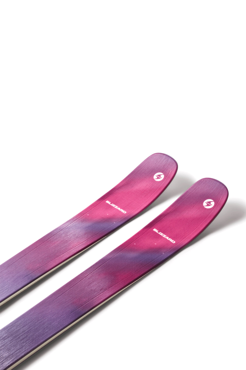 Pair of pink and purple skis on a white background