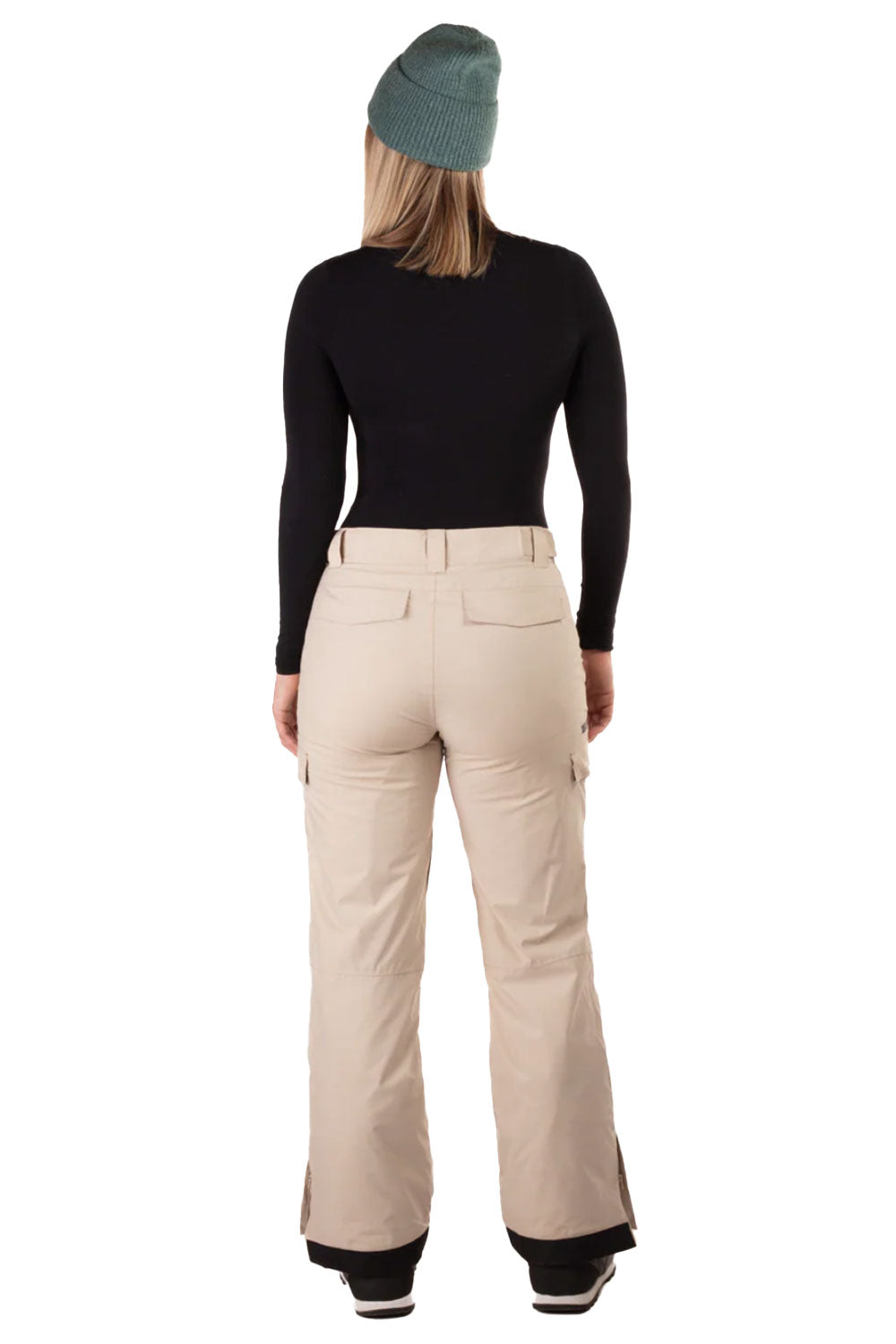 Person wearing beige snow pants and a black top on a white background
