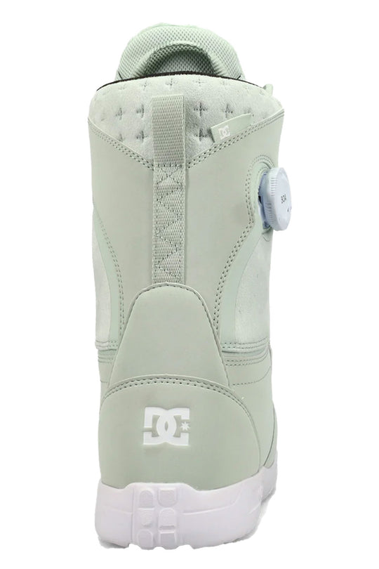 Light green snowboard boot with white sole on a white background