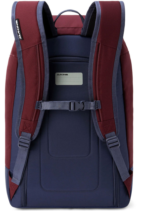 Back view of a red and navy backpack with visible Zaino branding.