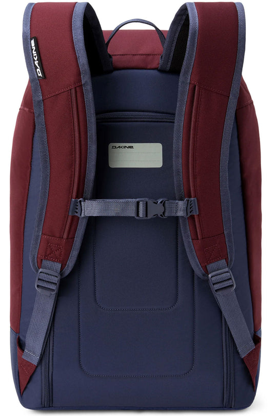 Back view of a red and navy backpack with visible Zaino branding.