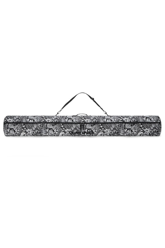 Black and white patterned yoga mat with carrying strap on a white background