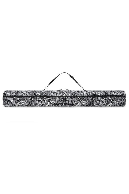 Black and white patterned yoga mat with carrying strap on a white background