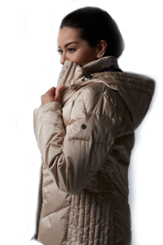 Woman wearing a beige quilted jacket on a white background