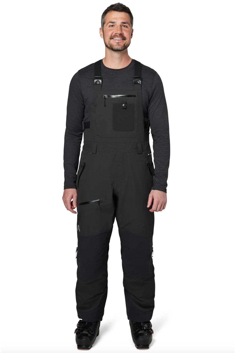 Man wearing a black bib overalls on a white background