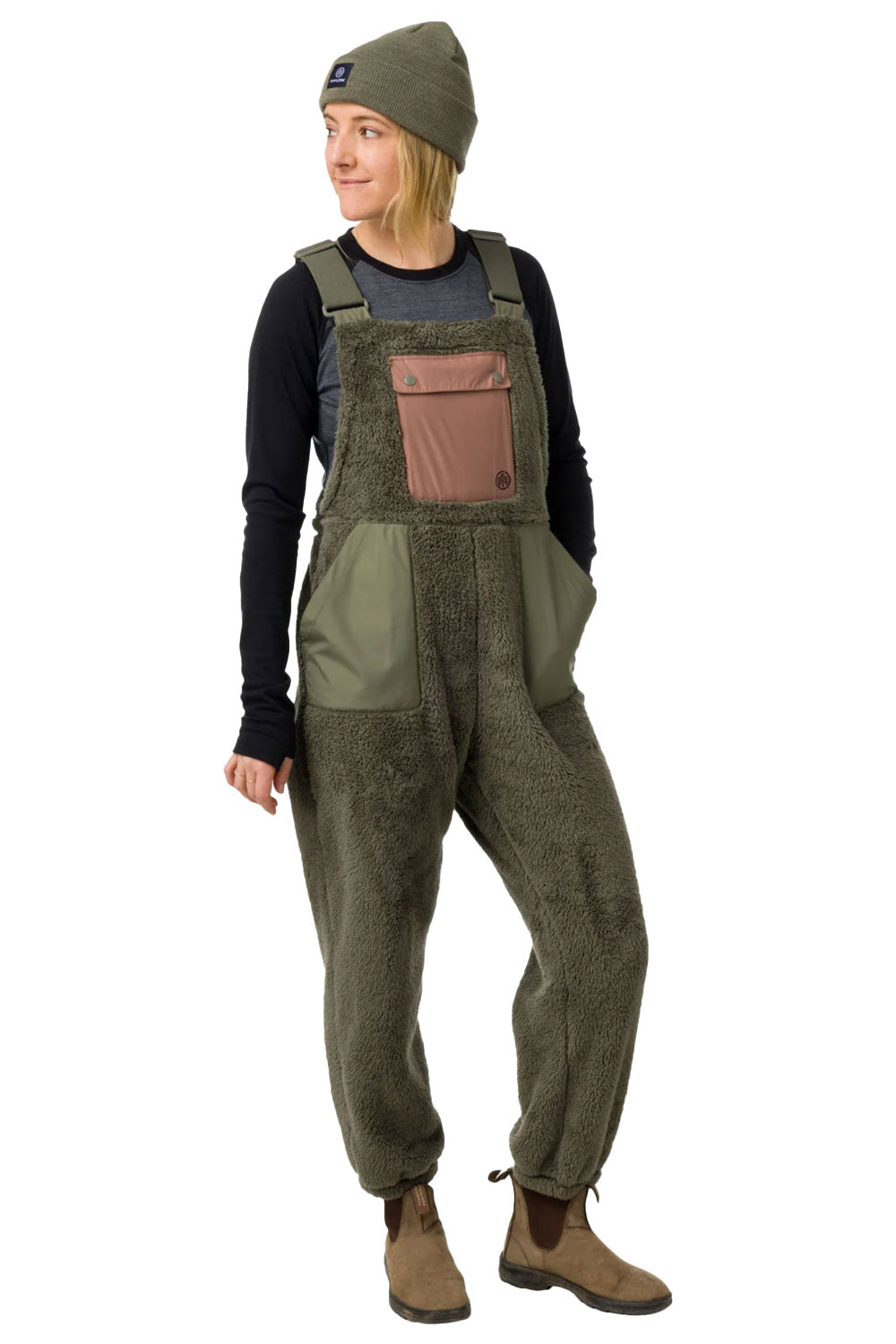 Person wearing green overalls with a brown pocket on a white background