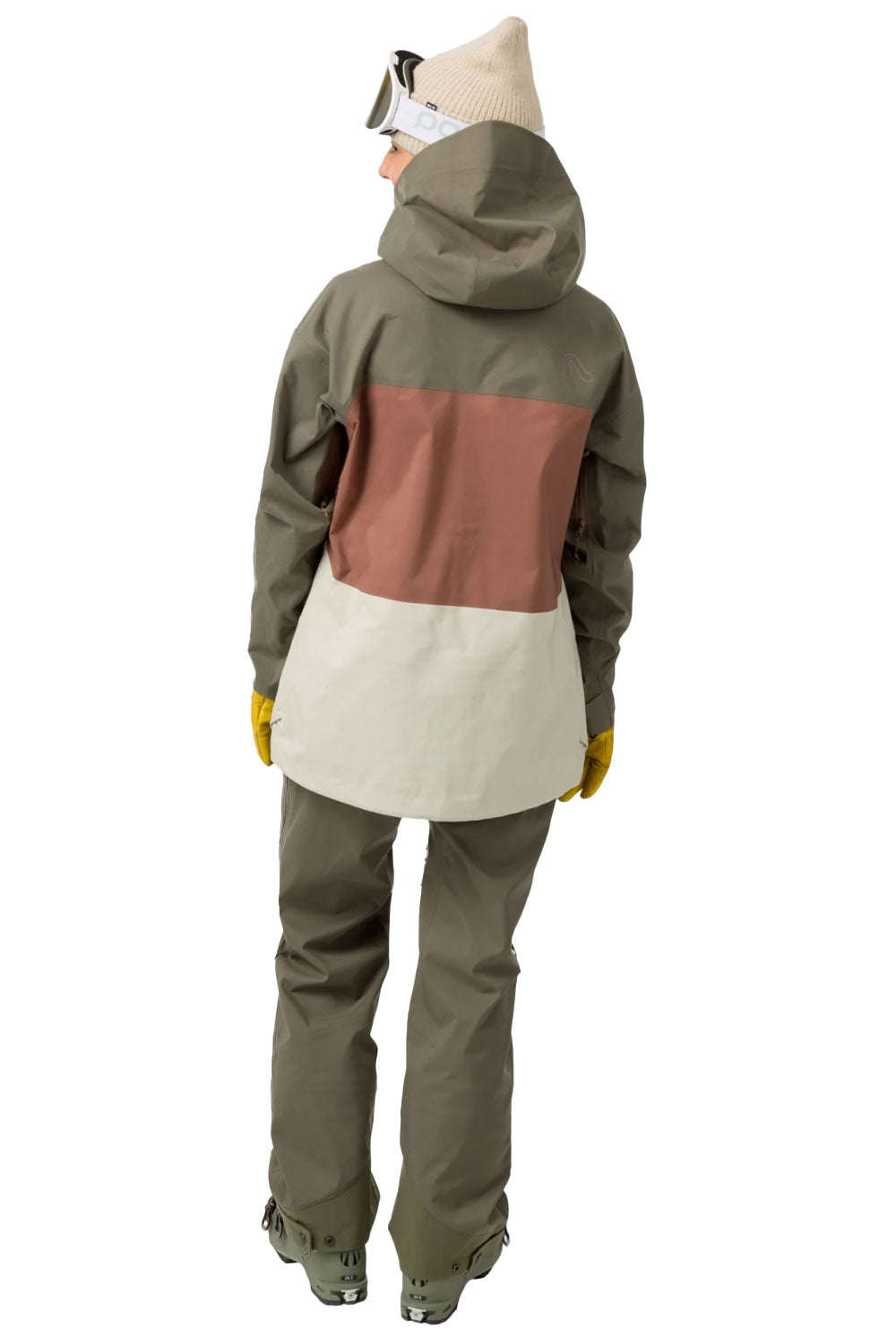 Person wearing a color-blocked jacket and pants on a white background