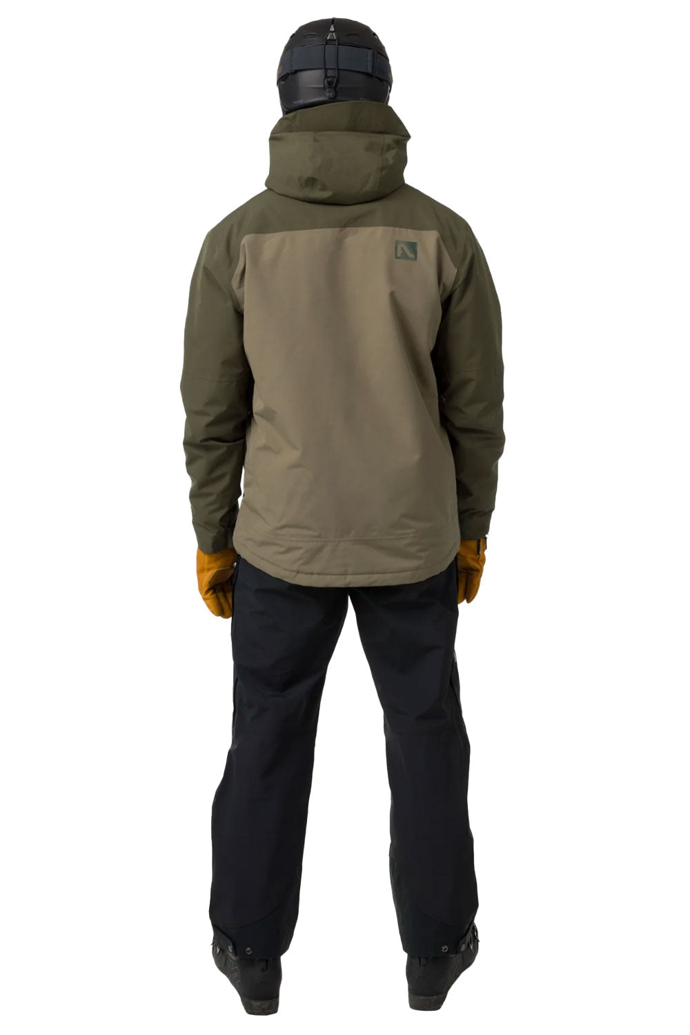 Person wearing a green jacket and black pants on a white background