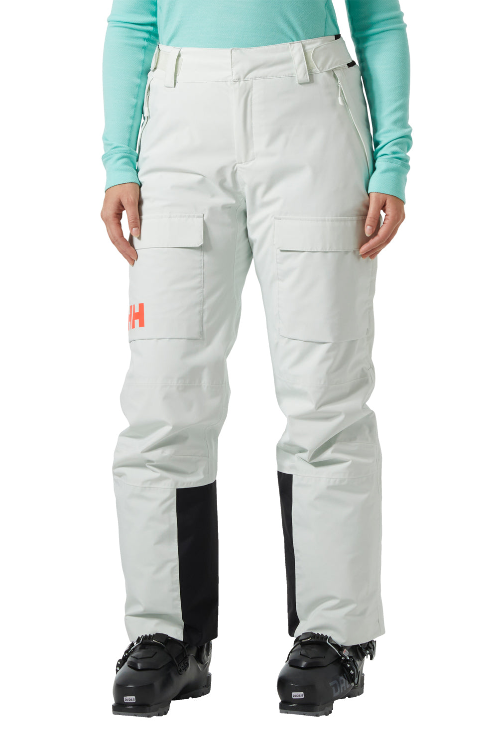 seamfoam green ski pants with black accents worn by a person on a white background