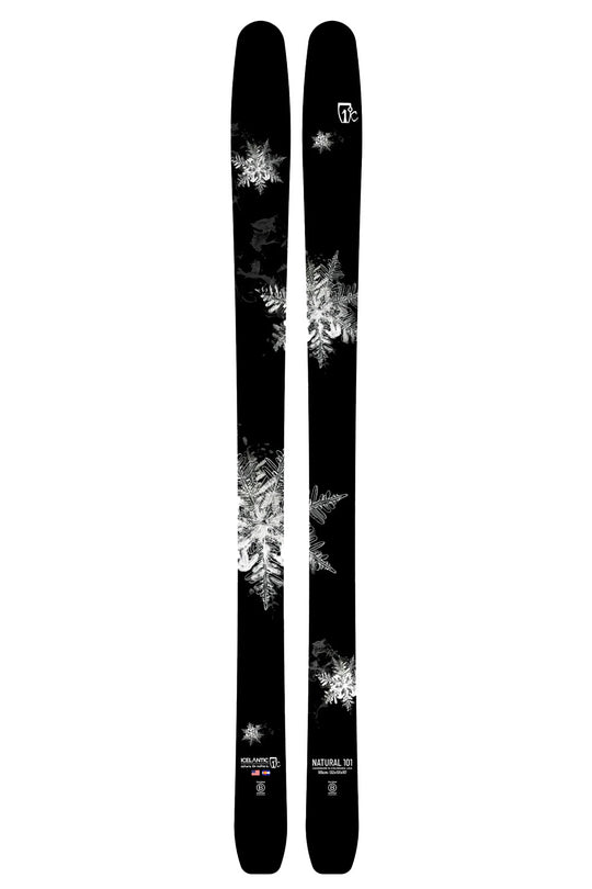 Two black skis with white snowflake patterns on a white background