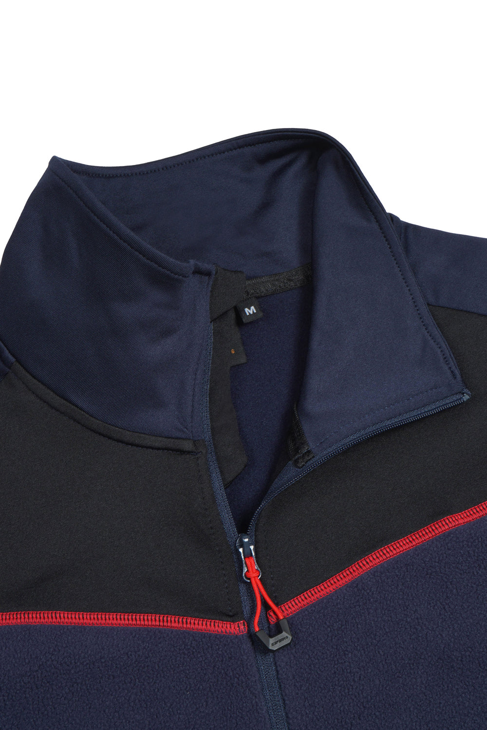 Close-up of a navy and black jacket with red zipper detail on a white background