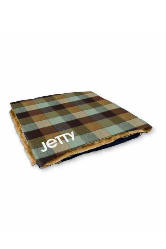 Plaid-patterned mat with 'Jetty' branding on a white background