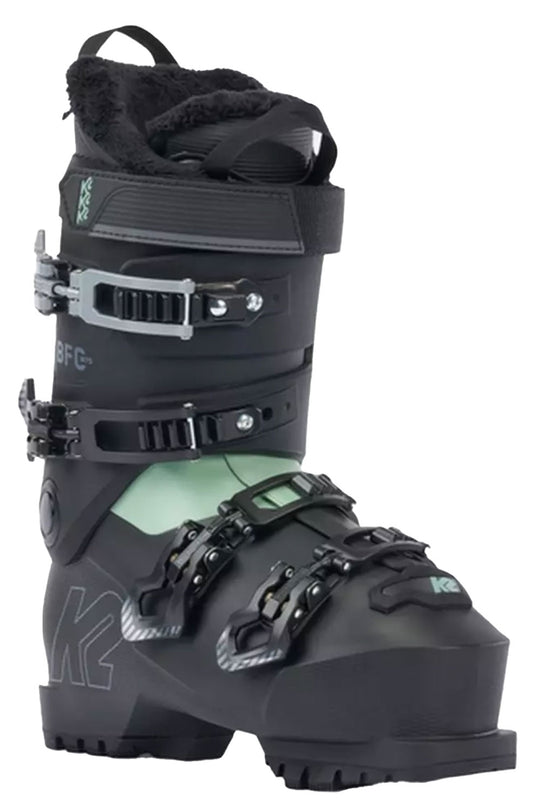 Black ski boot with green accents on a white background