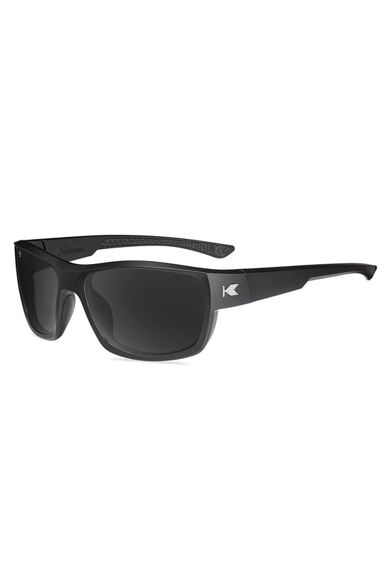 Black sunglasses with a brand logo on a white background