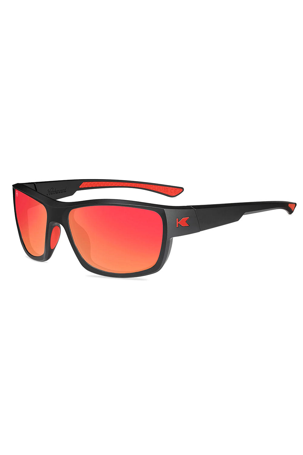 Sunglasses with black frame and red lenses on a white background