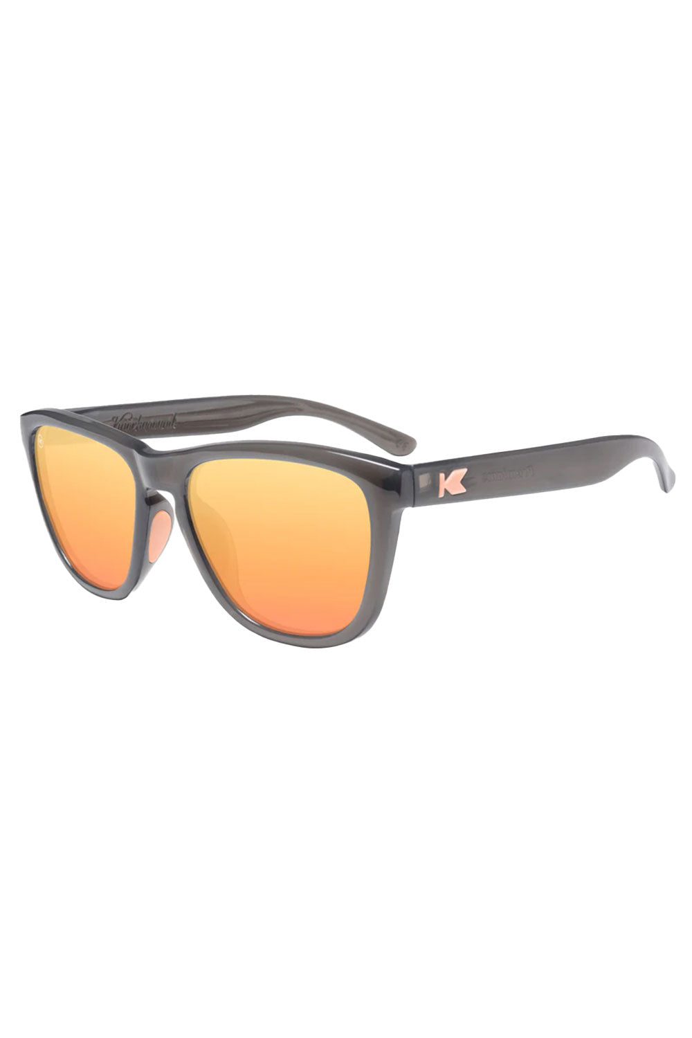 Sunglasses with orange lenses and gray frame on a white background