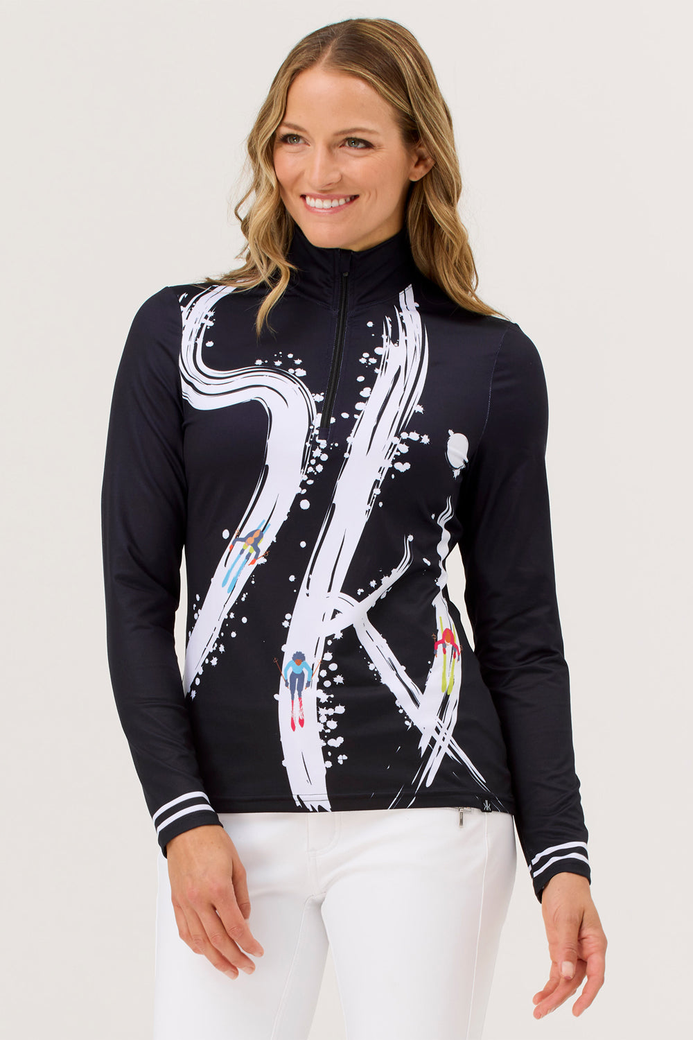 Woman wearing a black long-sleeve top with white ski design on a white background