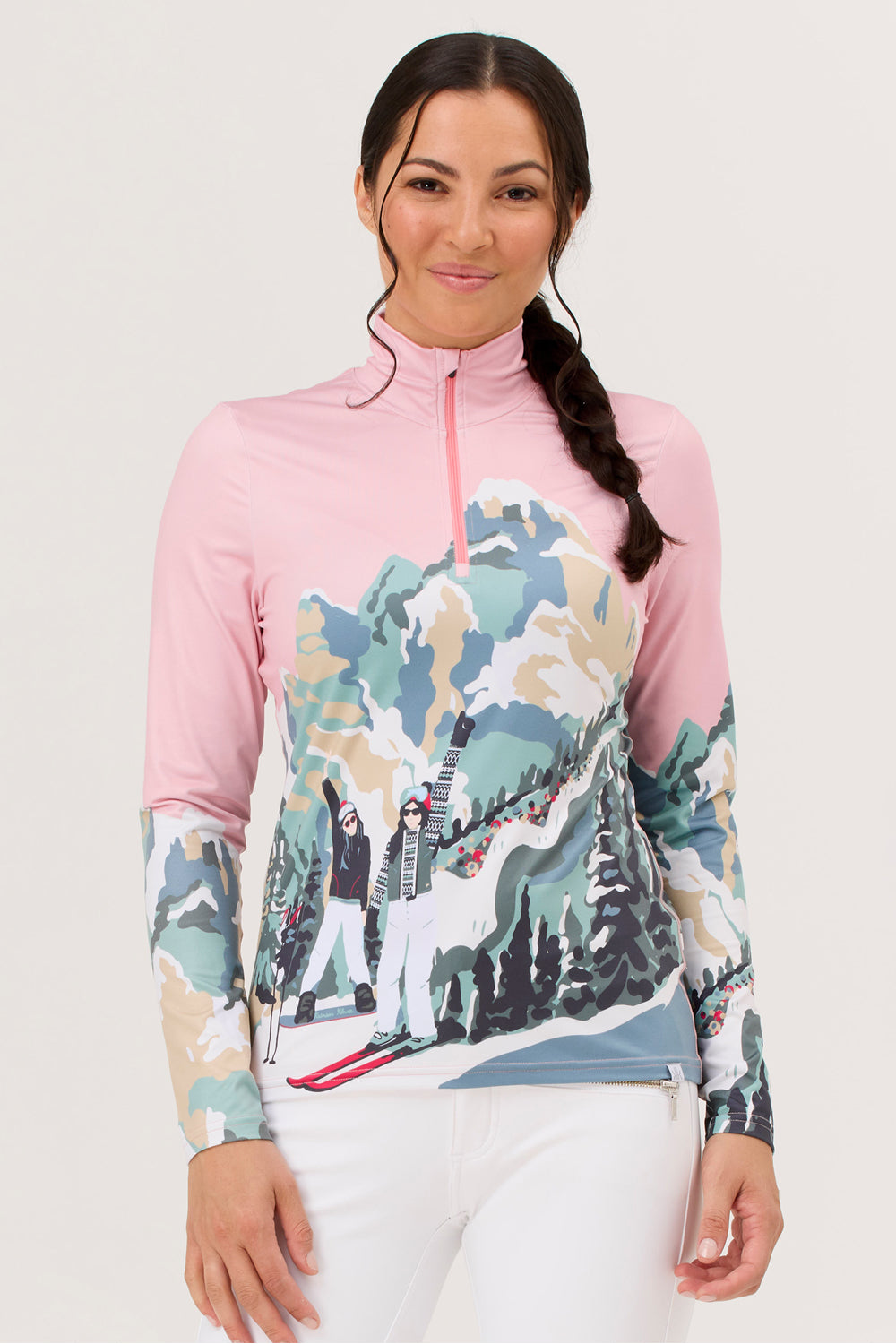 Woman wearing a pink and multicolored long-sleeve top with a mountain graphic on a white background