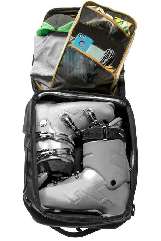 ski boots and supplies in ski boot backpack