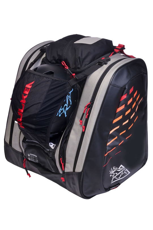 Black and gray ski boot backpack with red accents on a white background