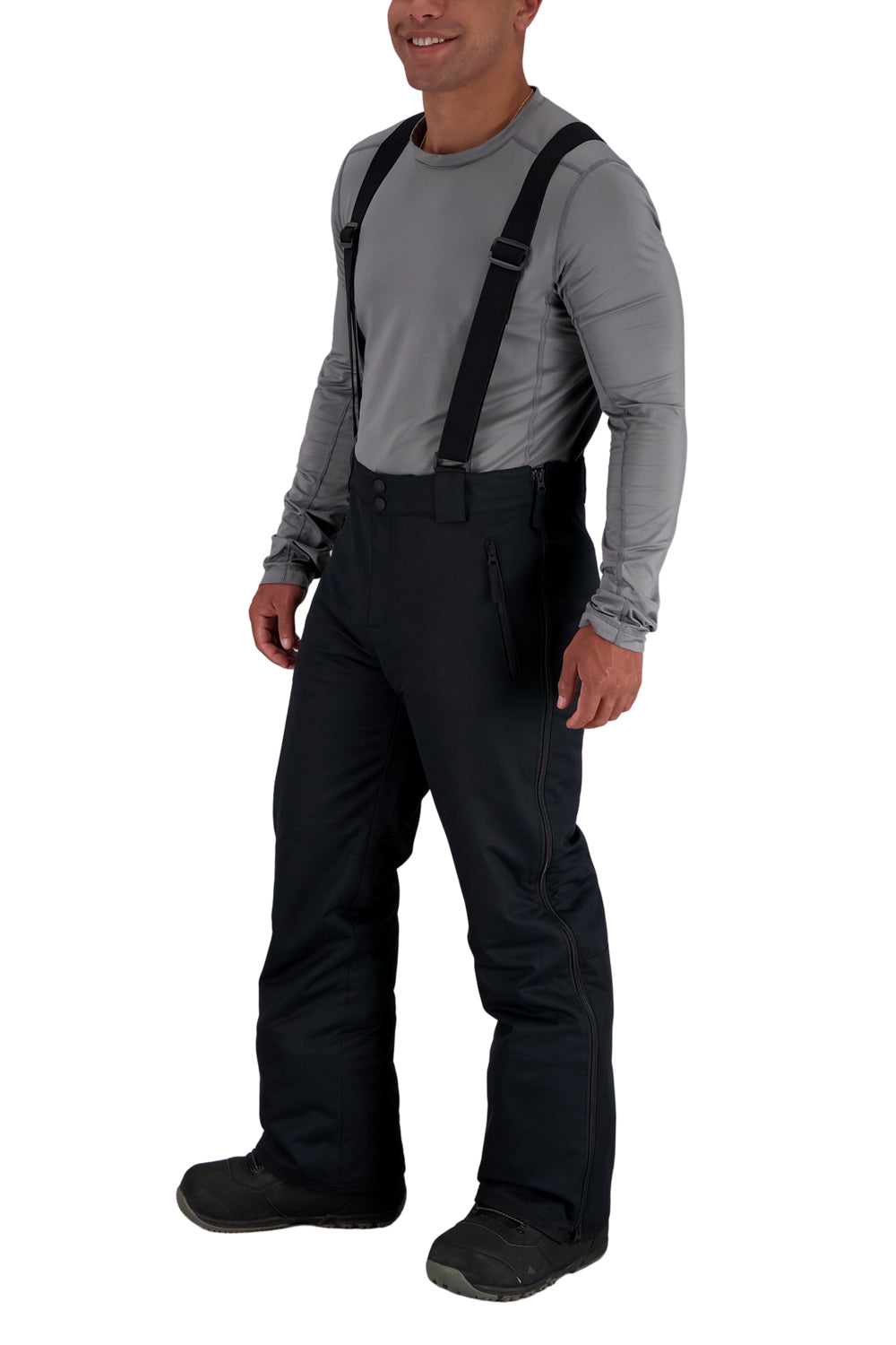 Person wearing black snow pants with suspenders on a white background