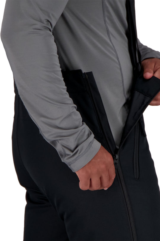 Person wearing black ski pants on a white background