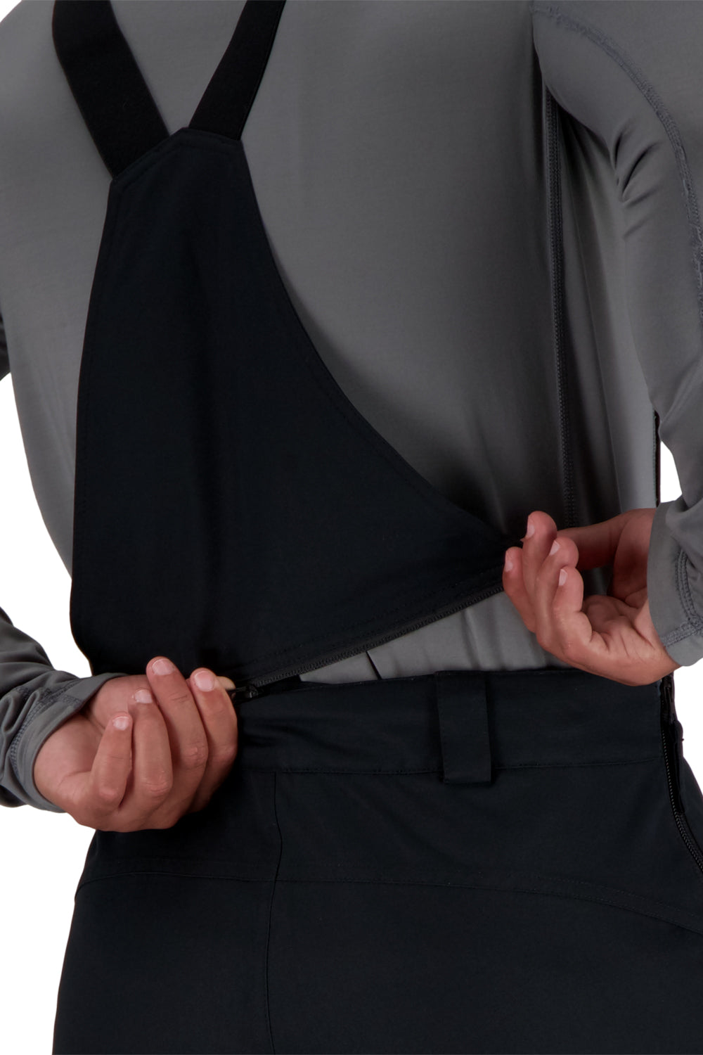 Person wearing black ski bib pants