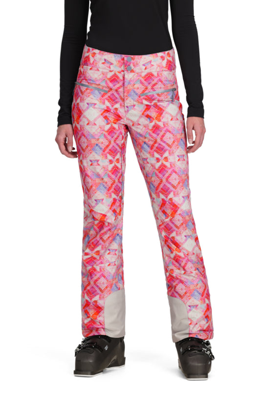 Person wearing colorful patterned pants on a white background