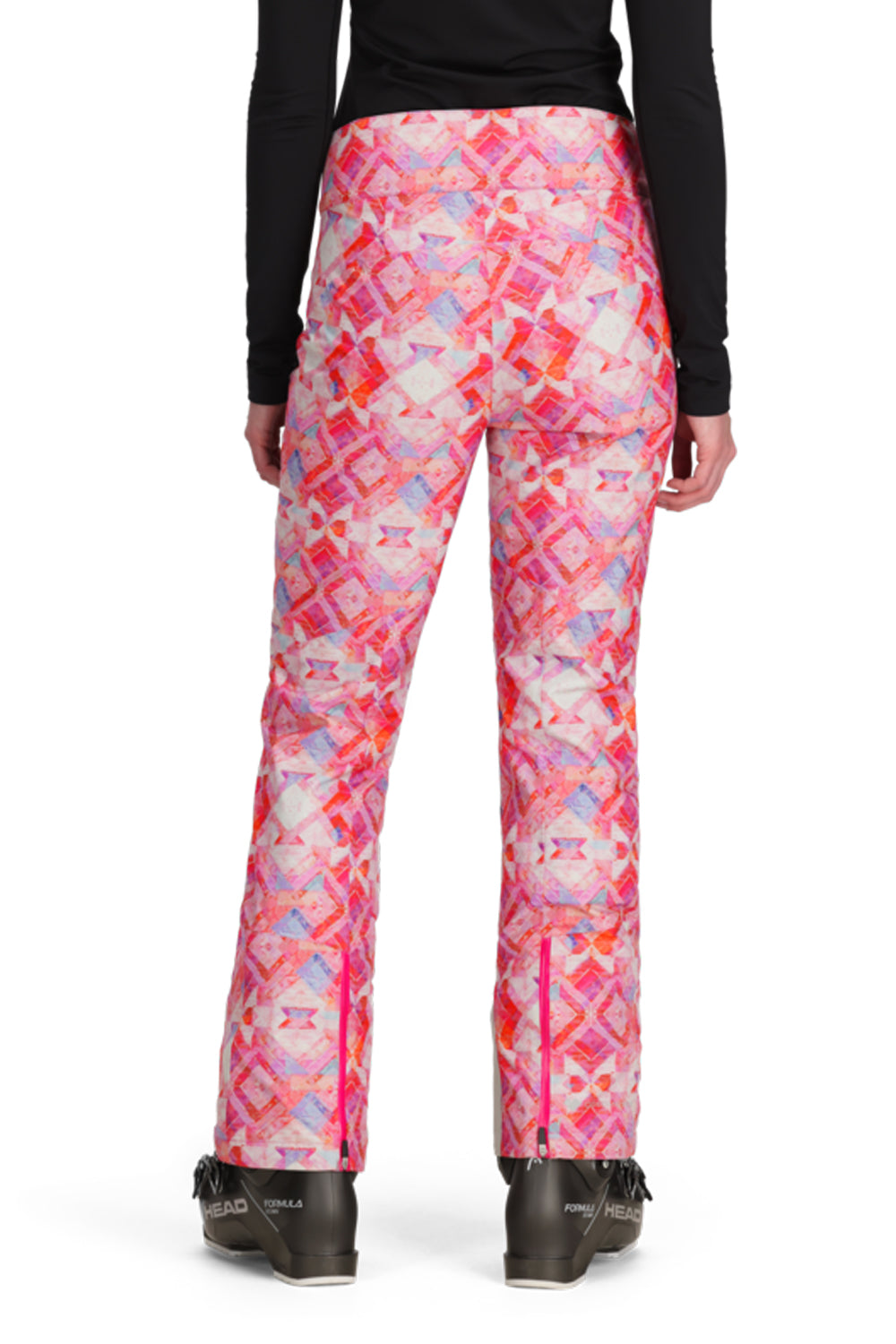 Pink patterned pants worn by a person on a white background