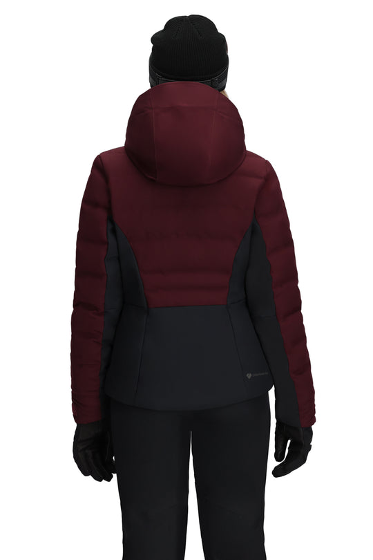 Maroon and black ski jacket worn by a person on a white background