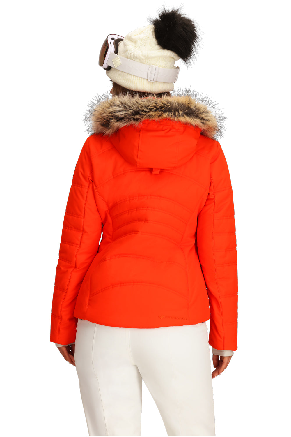 Person wearing an orange ski jacket with fur hood on a white background