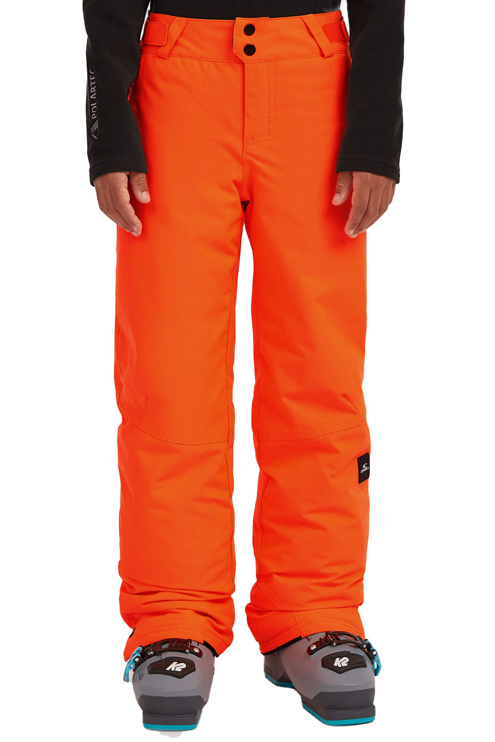 Orange snow pants worn by a person on a white background