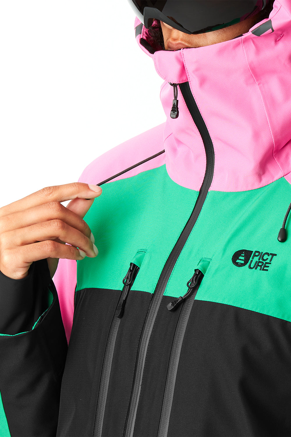 Person wearing a colorful jacket with a brand logo on a white background