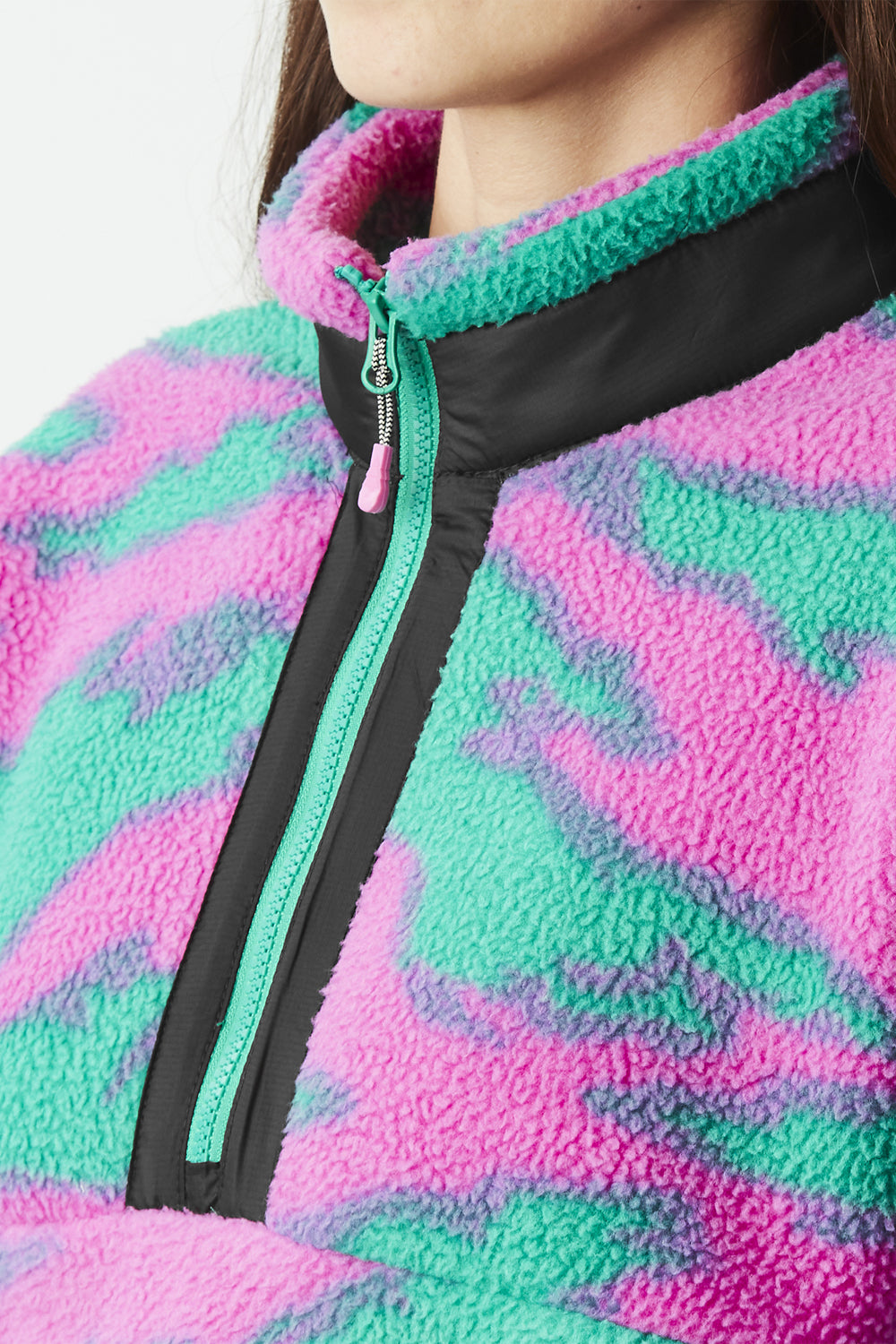 Close-up of a colorful fleece jacket with a zipper.