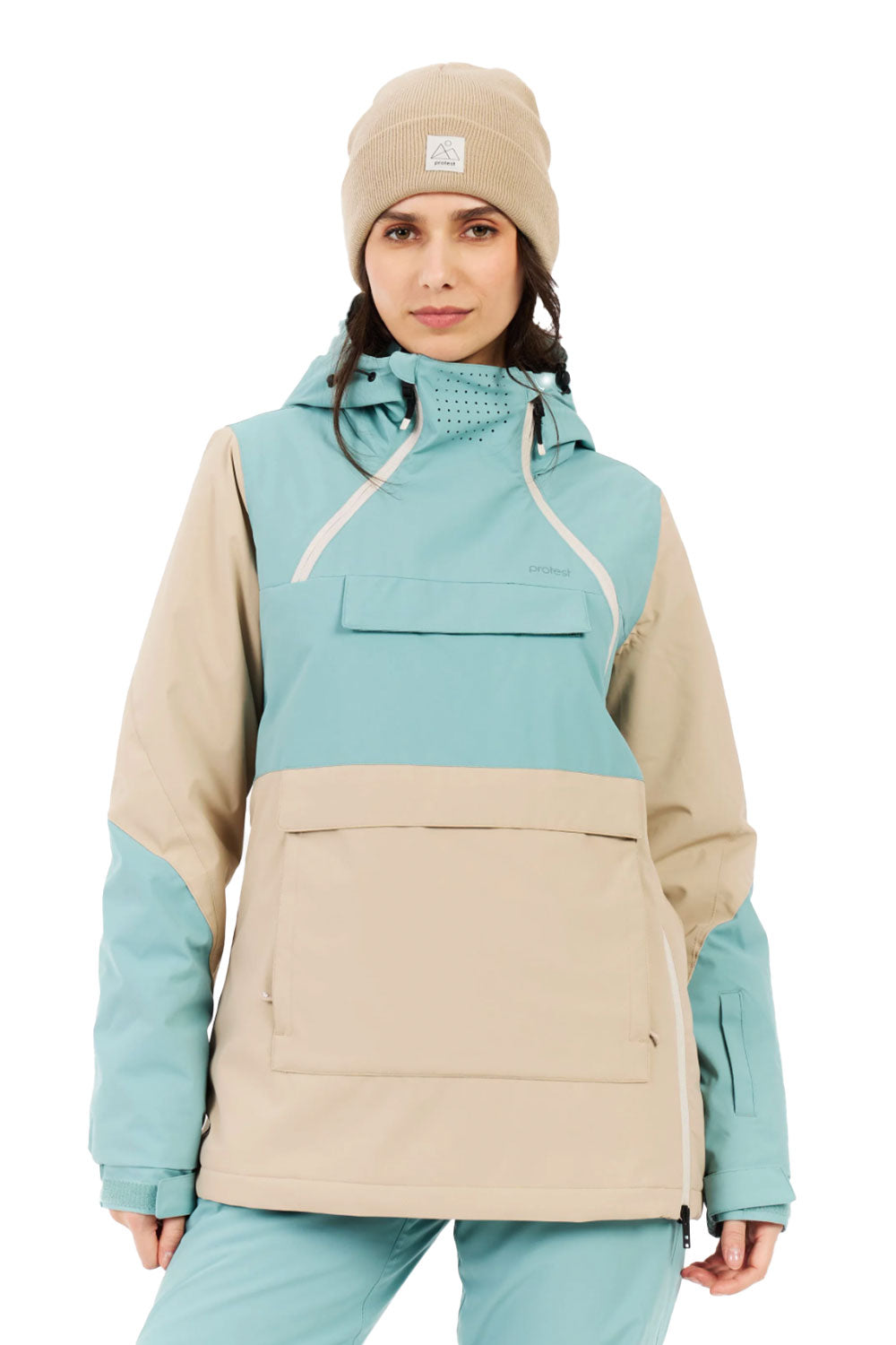 Woman wearing a two-tone jacket with teal and beige colors on a white background