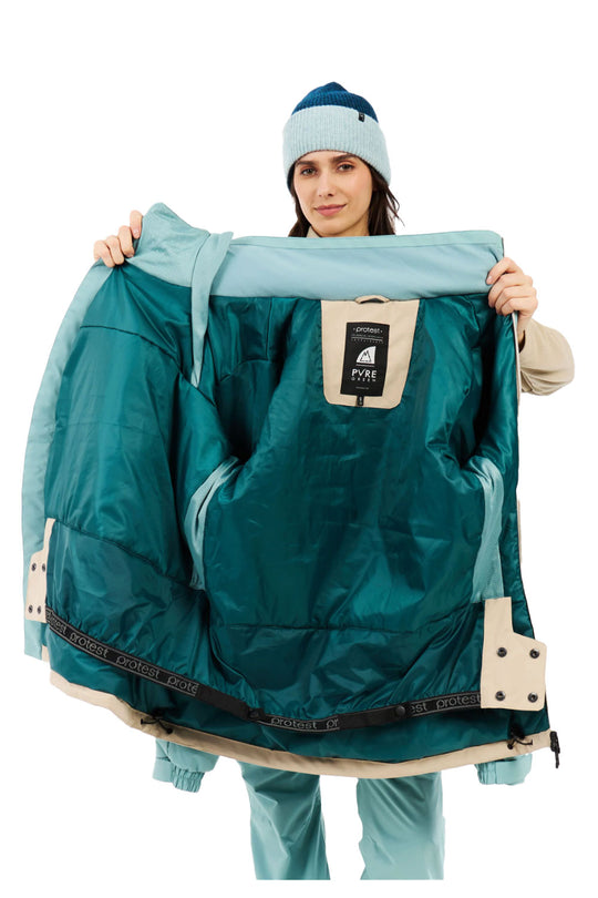 Person holding a teal and beige jacket with a visible brand logo on a white background