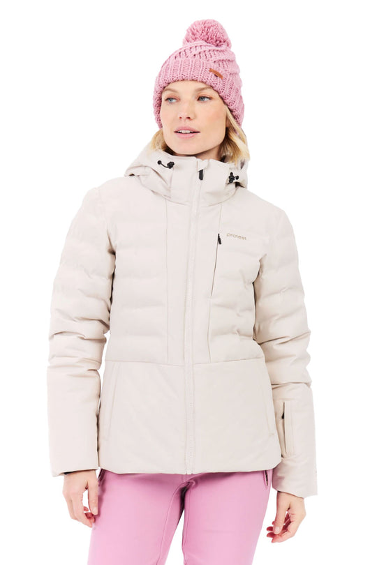 Woman wearing a beige winter jacket and pink pants with a pink beanie on a white background