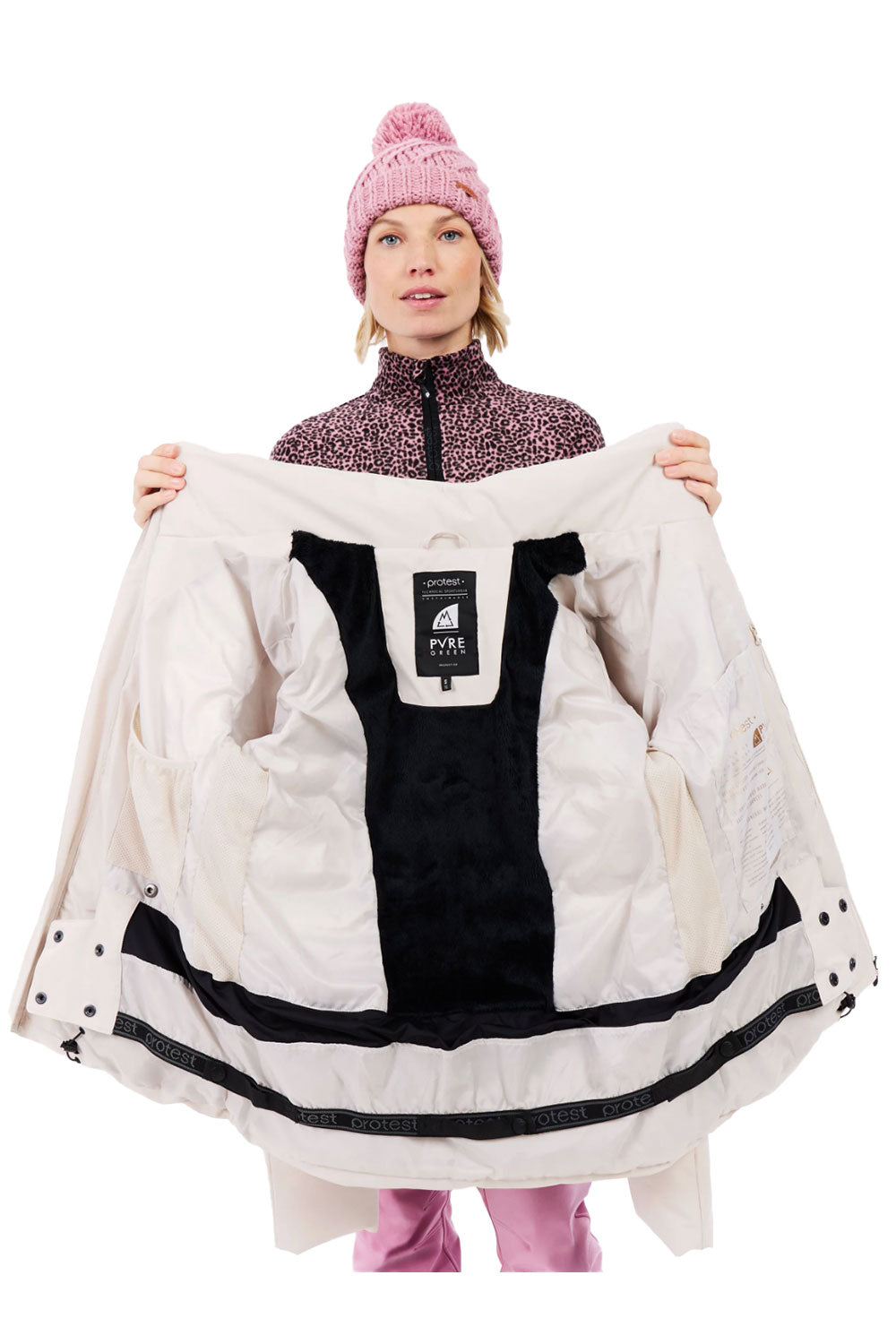 Person holding a white winter coat with a brand label on a white background