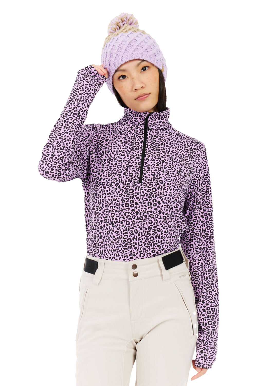 Person wearing a purple leopard print jacket and matching beanie on a white background