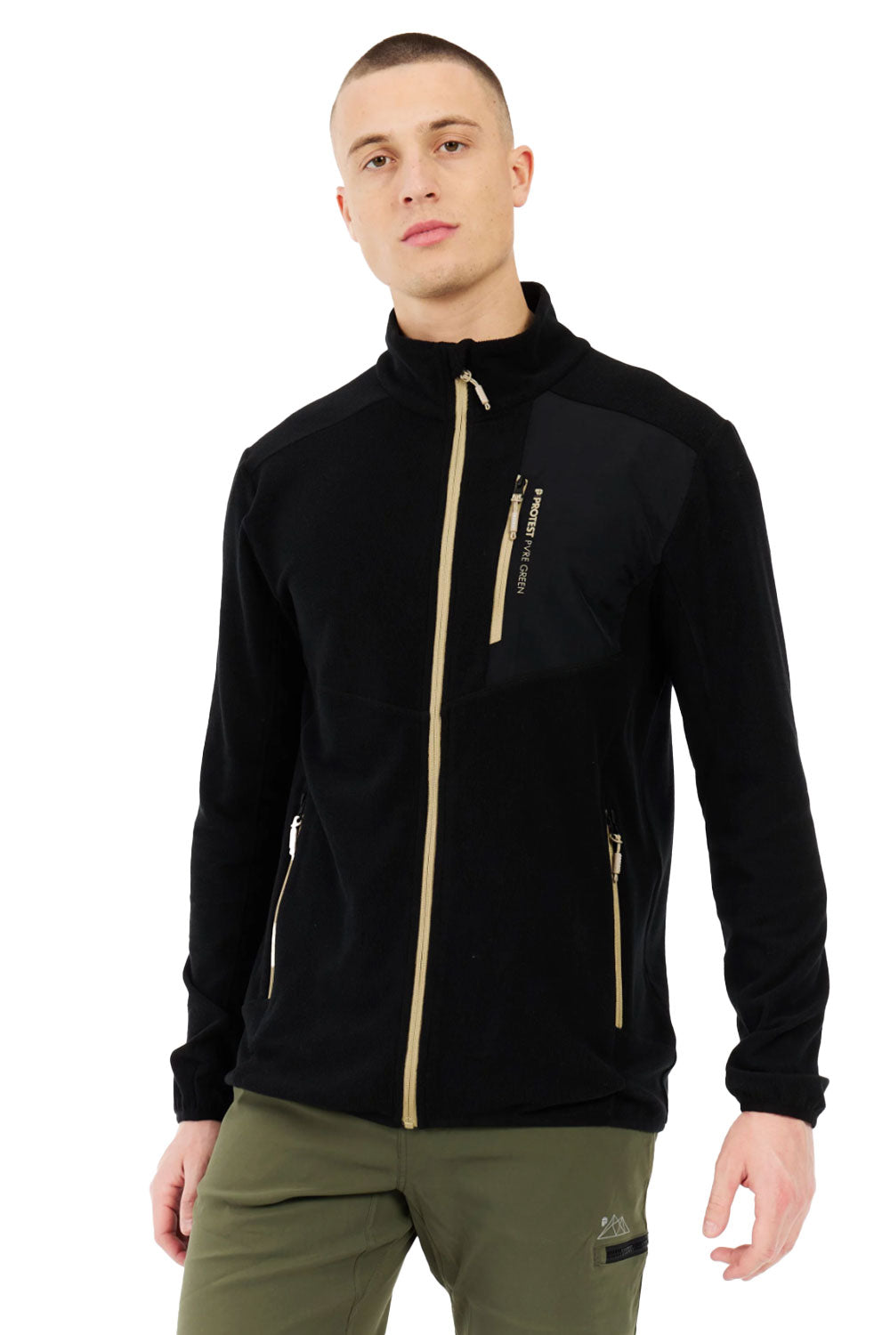 Man wearing a black jacket with gold zippers on a white background