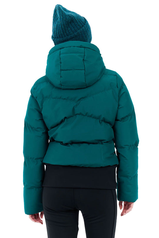 Teal puffer jacket worn by a person on a white background